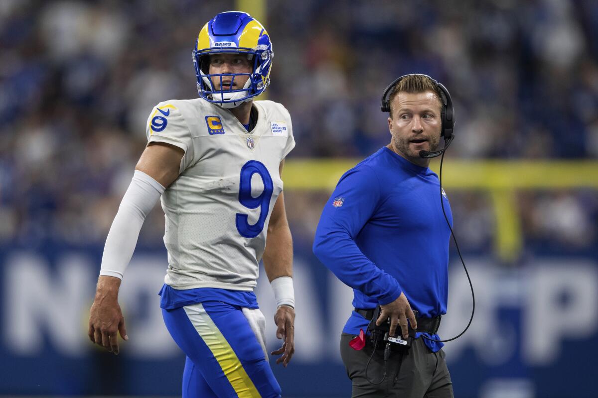 Rams head coach Sean McVay talks to quarterback Matthew Stafford.