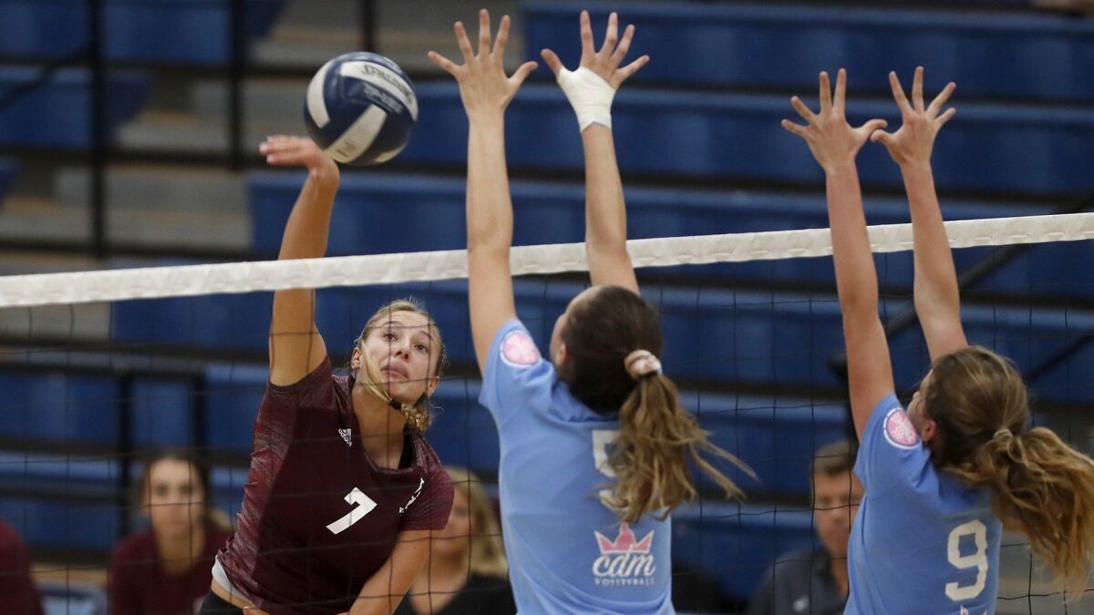 Laguna Beach High's Cambria Hall (7) scores during the second set of a Sunset Conference crossover match at Corona del Mar on Sept. 12.