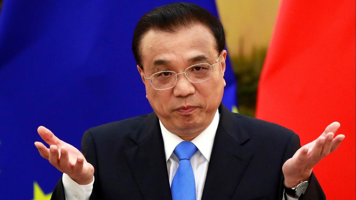 Chinese Premier Li Keqiang speaks to reporters at the 20th EU-China Summit at the Great Hall of the People in Beijing on July 16, 2018.