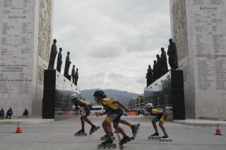 An all-girls skating team skates at Los Próceres near the Fuerte Tiuna military base in Caracas.