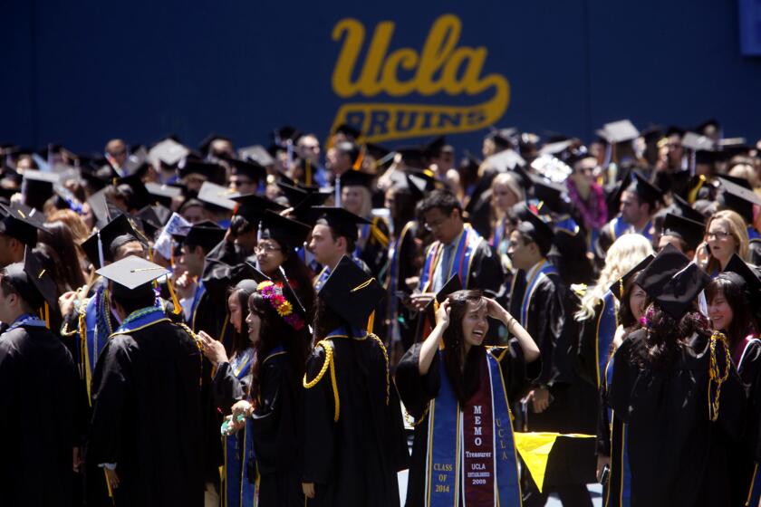 UCLA students make their way toward Pauley Pavilion for graduation ceremonies Friday. UCLA alumnus Randy Schekman, the 2013 Nobel Prize winner in physiology or medicine, delivered the keynote speech.
