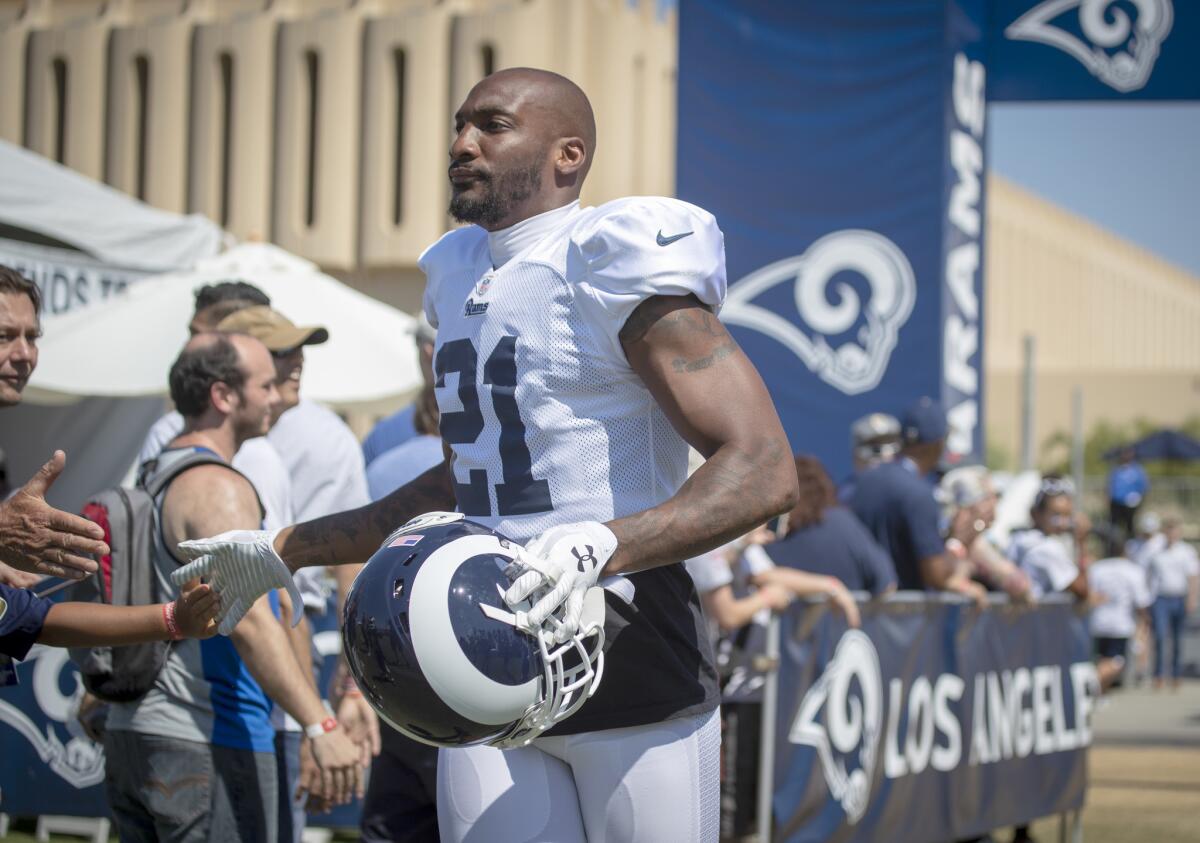 Rams cornerback Aqib Talib greets fans as he attends the Rams training camp at UC Irvine on Aug. 13.