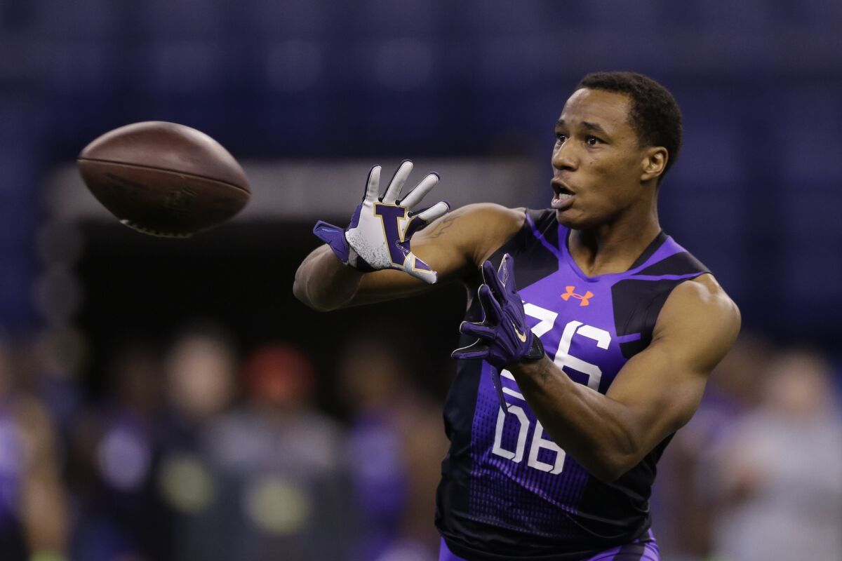 Washington defensive back Marcus Peters runs a drill at the NFL scouting combine in Indianapolis on Feb. 23.
