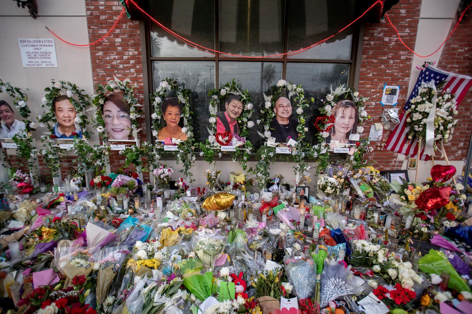 A memorial for the 11 shooting victims in front of the Star Ballroom Dance Studio in Monterey Park in January 2023.