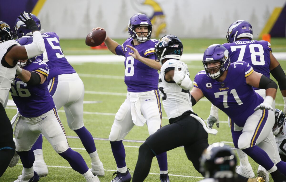 Minnesota Vikings quarterback Kirk Cousins (8) throws a pass during the first half of an NFL football game against the Jacksonville Jaguars, Sunday, Dec. 6, 2020, in Minneapolis. (AP Photo/Bruce Kluckhohn)