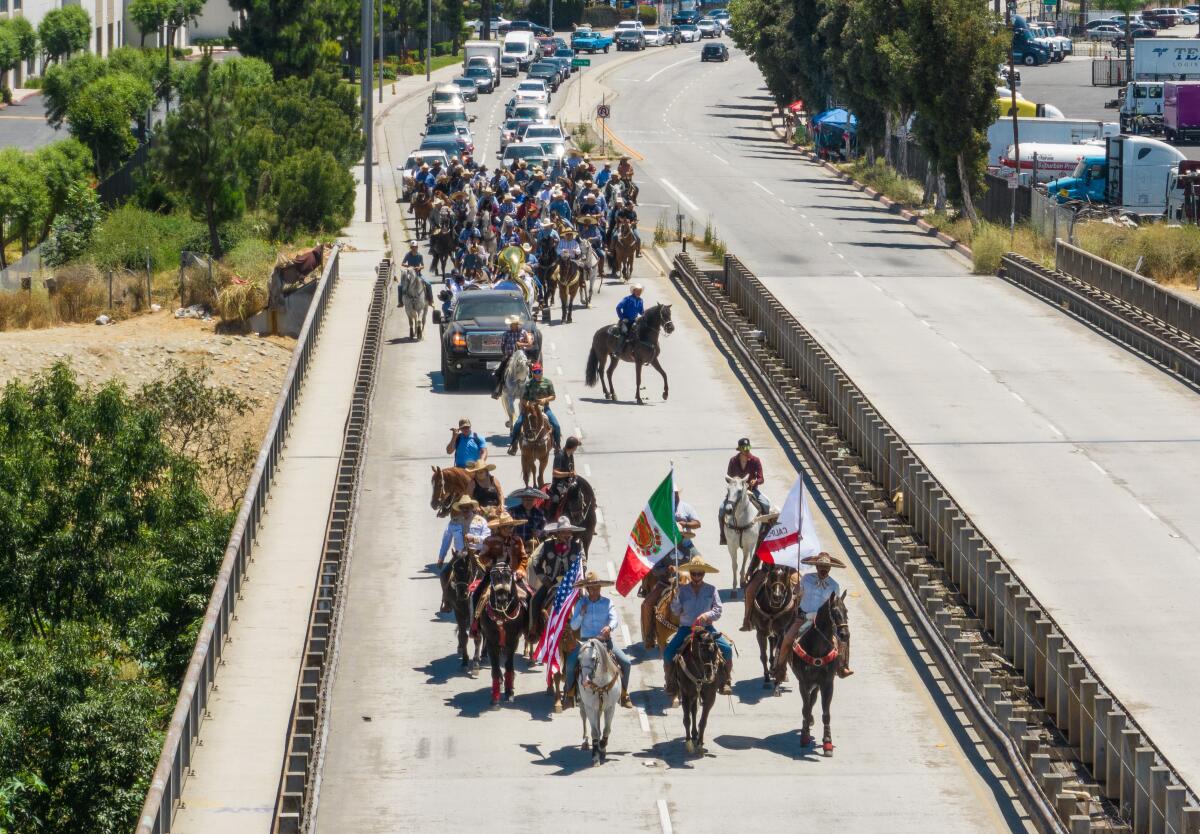 San Gabriel Valley horse owners walk on Peck Road in Whittier enroute to South El Monte City Hall.