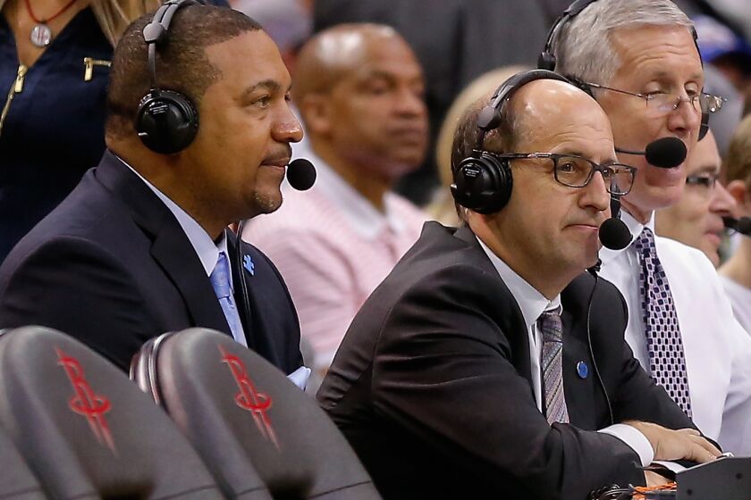 Commentators Marc Jackson, left, and Jeff Van Gundy look on during a basketball game Sunday, April 3, 2016, in Houston. Houston won 118-110. (AP Photo/Bob Levey)