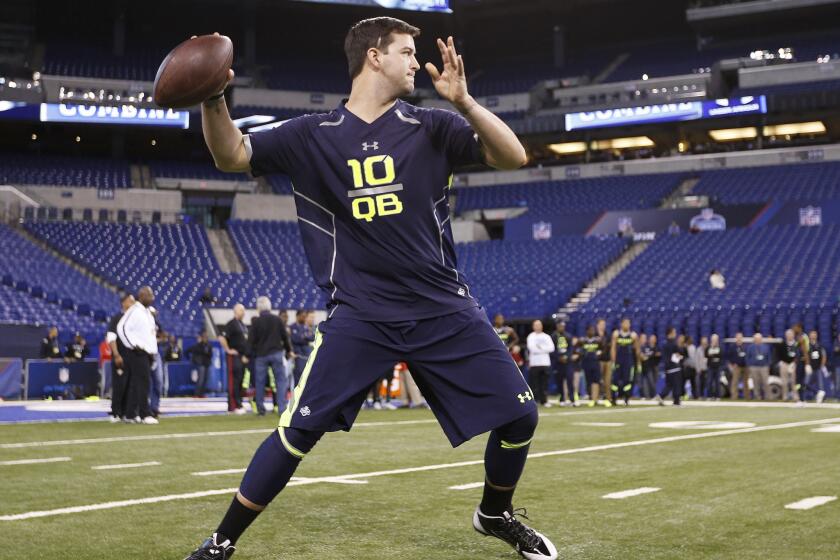 Former Alabama quarterback AJ McCarron works out during the NFL Combine at Lucas Oil Stadium in Indianapolis.