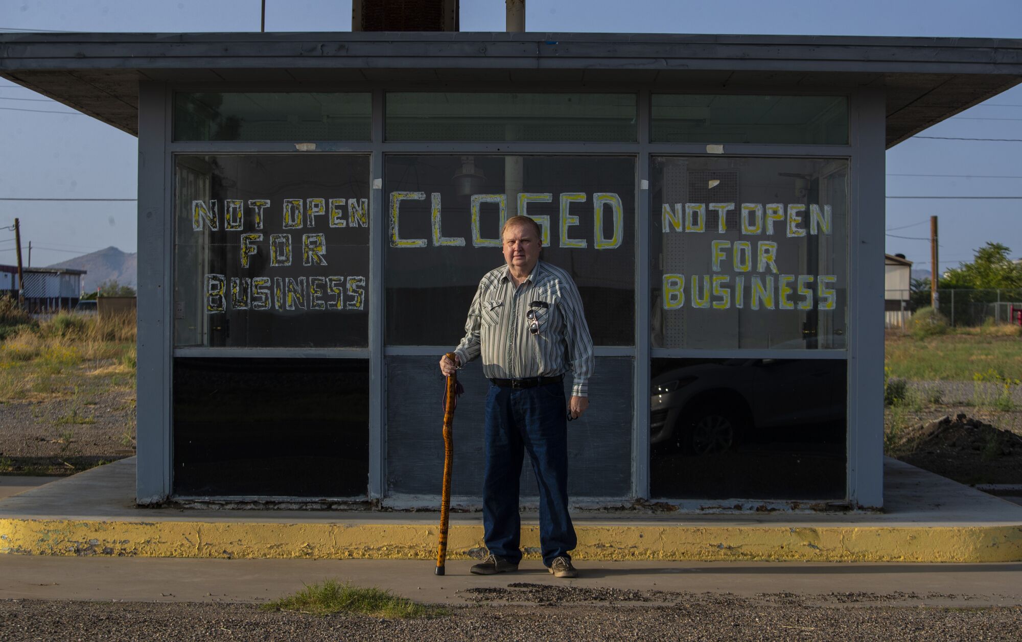 Lordsburg resident Dean Link stands at a former truck stop on Motel Drive in Lordsburg, NM. 