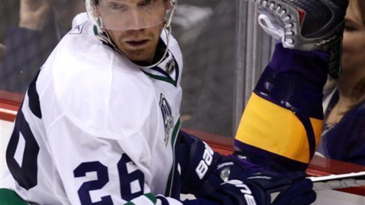 Drew Doughty & Anze Kopitar wearing old school purple & gold Kings