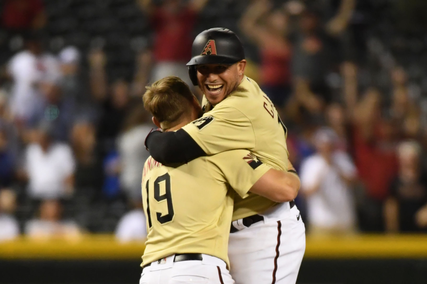 The Diamondbacks' Asdrubal Cabrera celebrates with Josh VanMeter after getting the game-winning hit against the Dodgers.