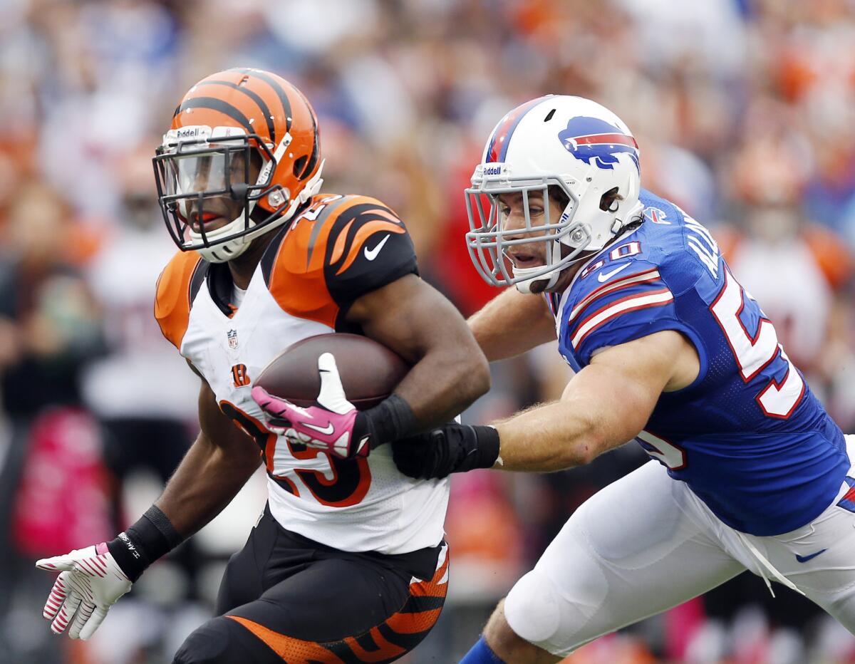 Buffalo's Kiko Alonso, right, pursues Cincinnati's Giovani Bernard in a game last October.