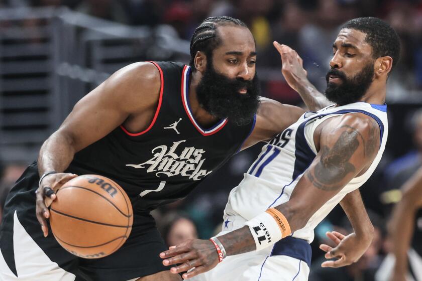 Los Angeles, CA, Tuesday, April 23, 2024 - LA Clippers guard James Harden (1) is tightly guarded by Dallas Mavericks guard Kyrie Irving (11) in game two of the NBA Western Conference playoffs at Crypto.Com Arena. (Robert Gauthier/Los Angeles Times)
