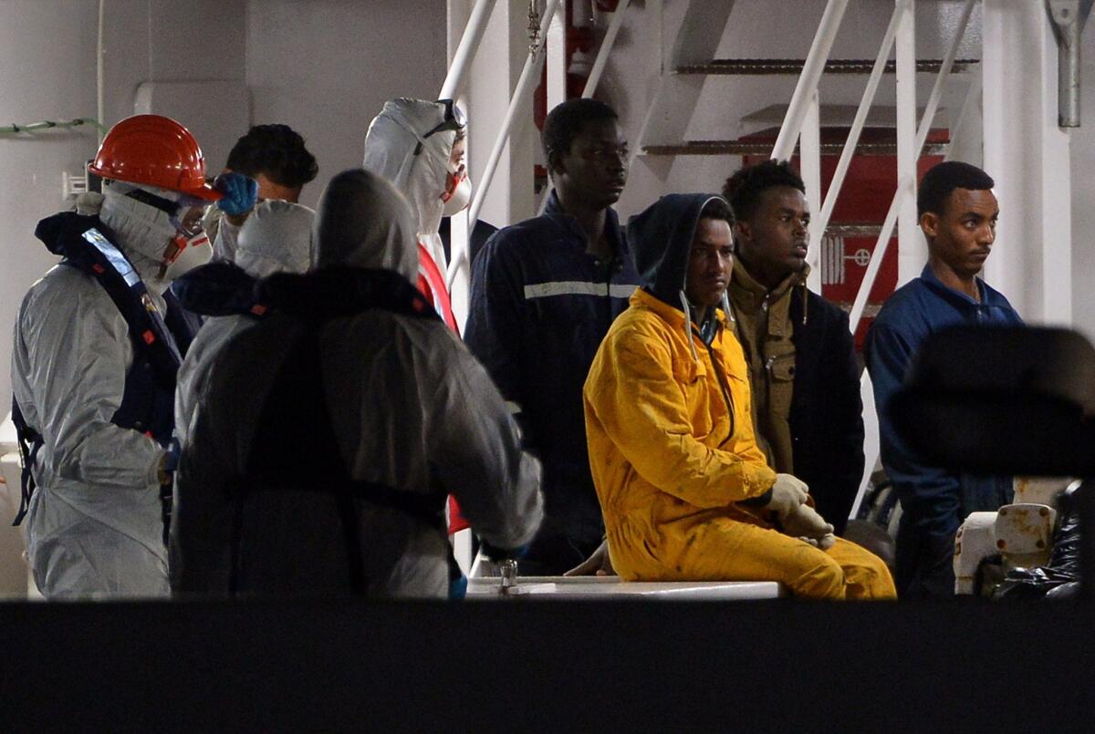 Migrants rescued off the Libyan coast arrive at the harbor in Catania, Italy, on April 20.
