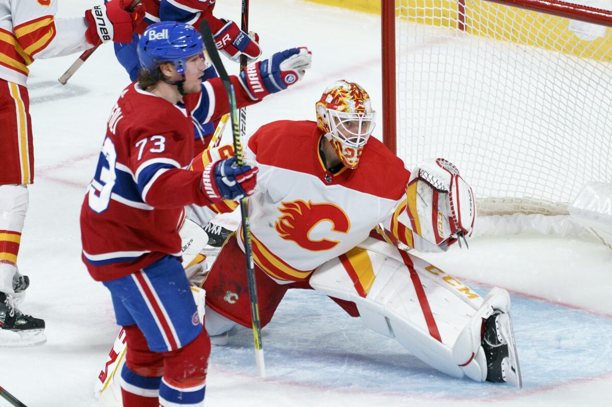 Montreal Canadiens' Tyler Toffoli celebrates his goal past Calgary Flames goaltender Jacob Markstrom during the second period of an NHL hockey game Friday, April 16, 2021, in Montreal. (Paul Chiasson/The Canadian Press via AP)