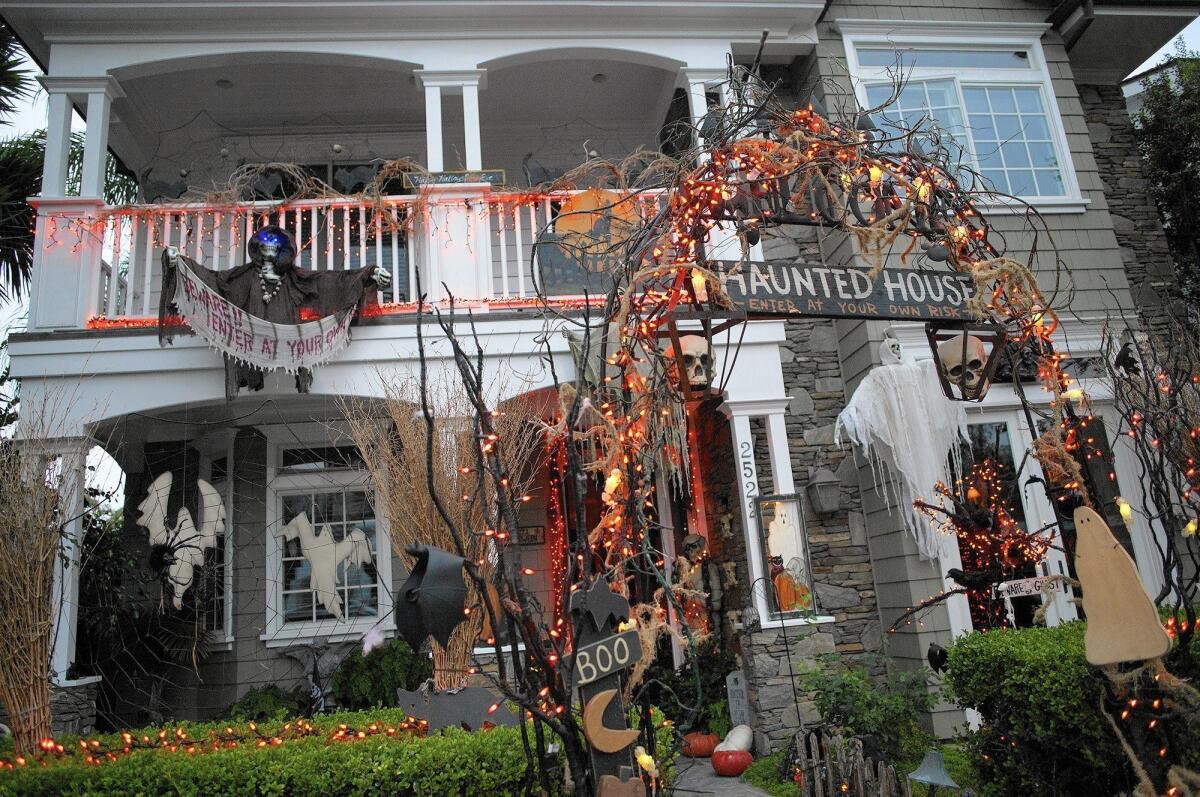 Halloween decorations frame the front entrance of Kathy and Mike Bell's residence in Newport Beach.