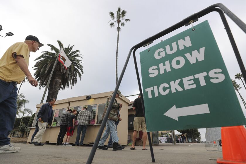 People buy tickets to the Crossroads of the West Gun Show at the Del Mar Fairgrounds on Saturday, December 14, 2019 in Del Mar, California.