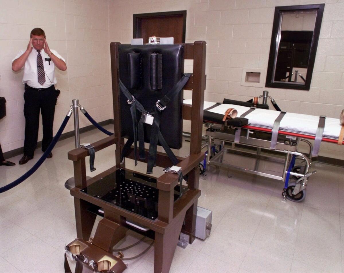 Ricky Bell, the warden at Riverbend Maximum Security Institution in Nashville, gives a tour of the prison's execution chamber in 1999.