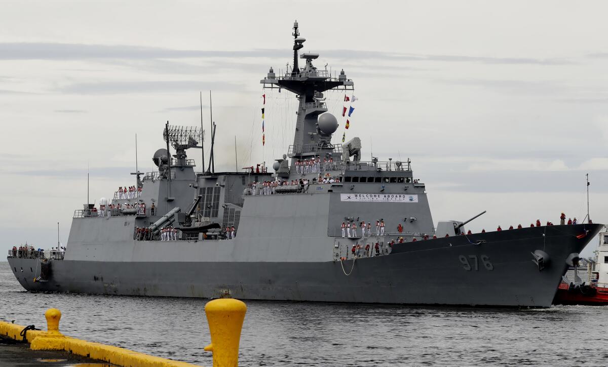 FILE - In this Sept. 2, 2019, file photo, South Korean navy destroyer, the Munmu The Great, prepares to dock at the Manila South Harbor for a three-day port call off Manila, Philippines. South Korea said Sunday, July 18, 2021, it'll send military transport aircraft to bring back hundreds of sailors aboard the destroyer on an anti-piracy mission after nearly 70 of them tested positive for coronavirus. (AP Photo/Bullit Marquez, File)