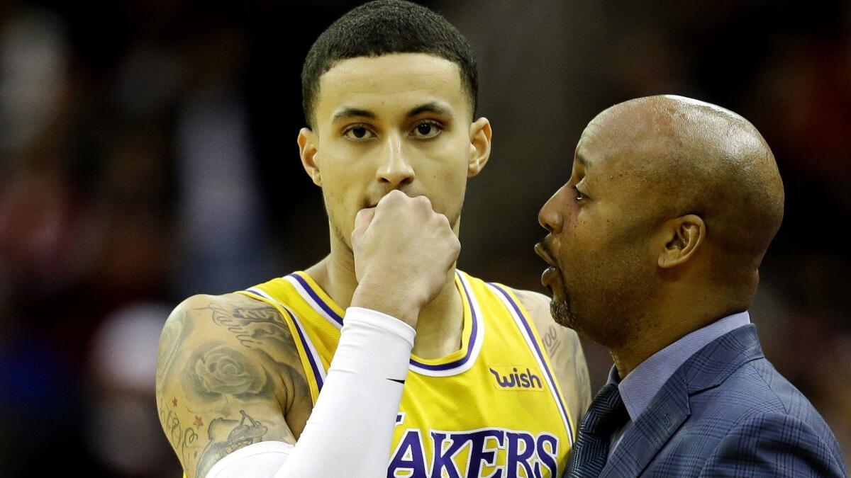 Lakers forward Kyle Kuzma, chatting with associate head coach Brian Shaw, has played in 47 of the Lakers' 49 games this season.