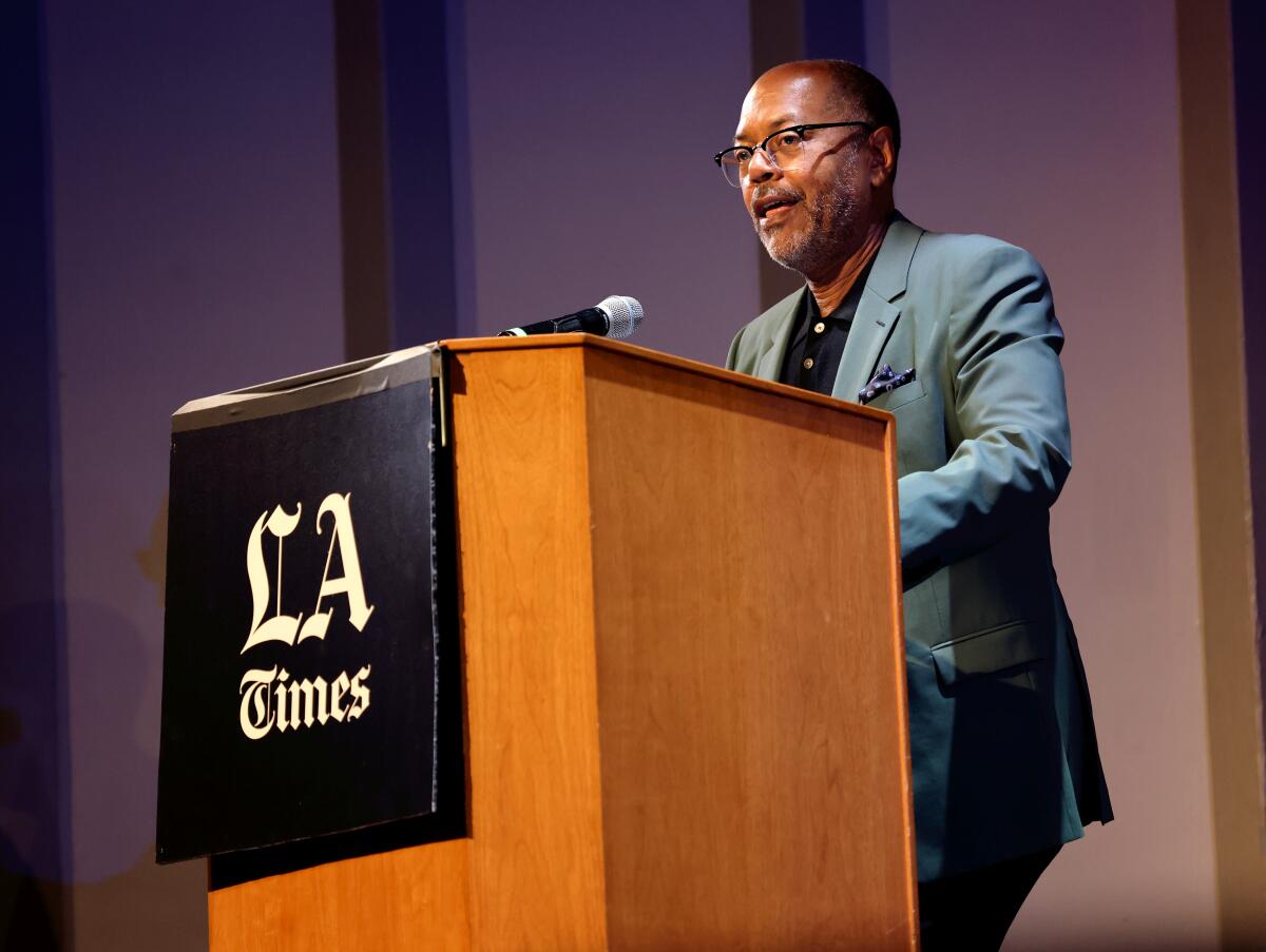 Los Angeles Times Executive Editor Kevin Merida stands at a lectern.