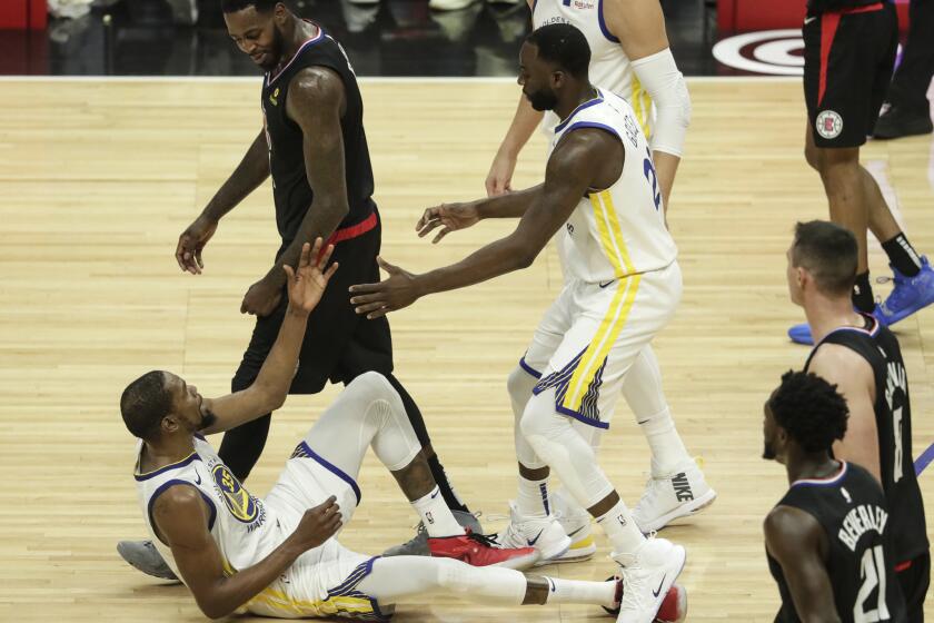 LOS ANGELES, CA, THURSDAY, APRIL 18, 2019 - JaMychal Green talks to Kevin Durant after knocking him to the court for a third quarter offensive foul on the Clipper in game three of the first round of the NBA Western Conference Playoffs at Staples Center. (Robert Gauthier/Los Angeles Times)