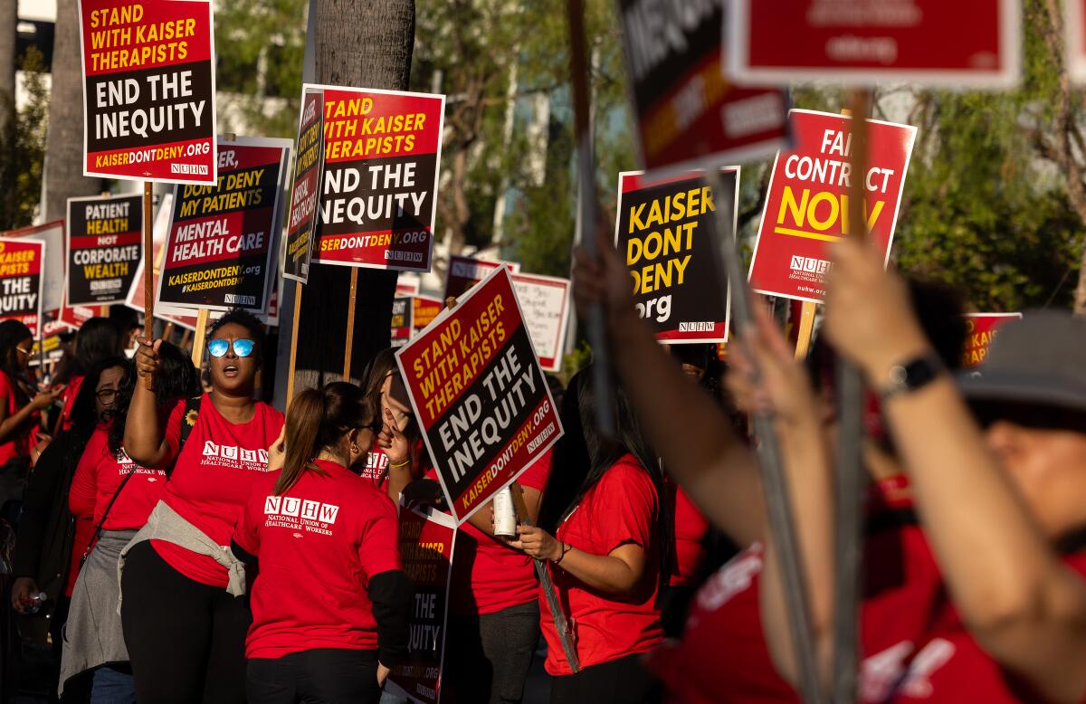 Mental health professionals who work for Kaiser Permanente walk a picket line at Kaiser Permanente Los Angeles.