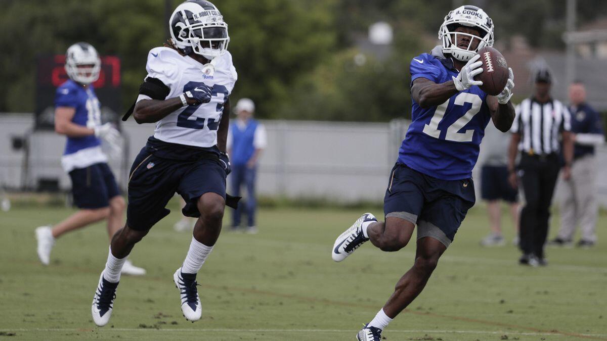 Rams receiver Brandin Cooks catches a long pass from quarterback Jared Goff past defensive back Nickell Robey-Coleman at Cal Lutheran University.