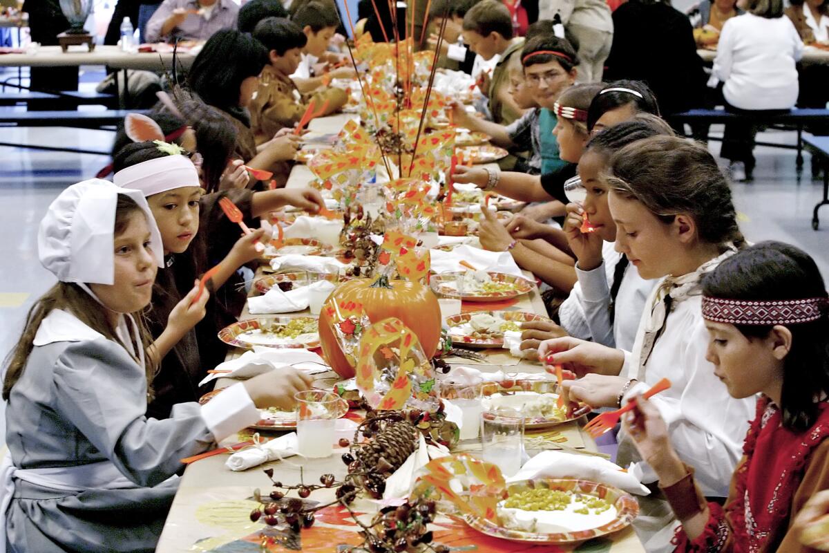 La Cañada Elementary fifth-grade students enjoy a Thanksgiving feast in 2011 dressed as Pilgrims or Native Americans. This year, the students were asked to forgo such costumes out of cultural sensitivity, a mistake in columnist Joe Puglia's opinion, that should be rectified.