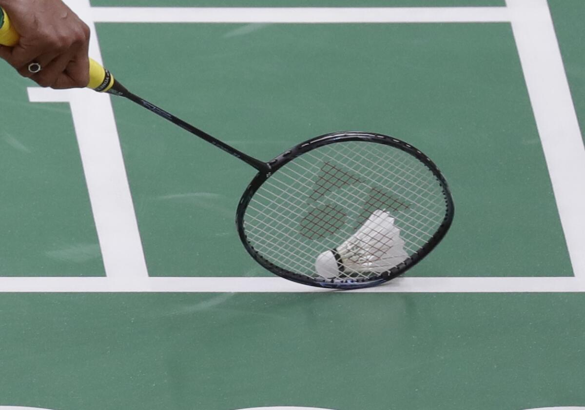 India's Srikanth Kidambi picks up the shuttlecock during a Men single match.