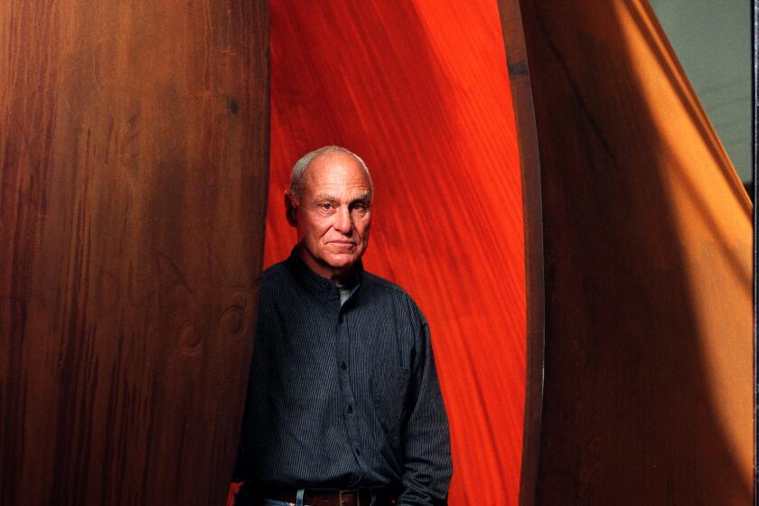 Sculptor Richard Serra with one of his steel sculptures at the Geffen Contemporary in 1998.