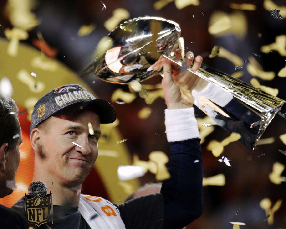 Denver Broncos quarterback Peyton Manning holds up the Lombardi Trophy after winning Super Bowl 50 in Santa Clara on Feb. 7.