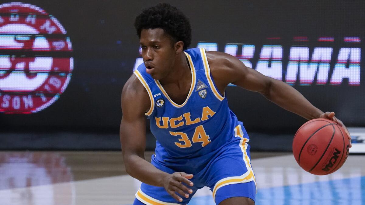 UCLA guard David Singleton dribbles during the Bruins' win over Alabama on March 28.