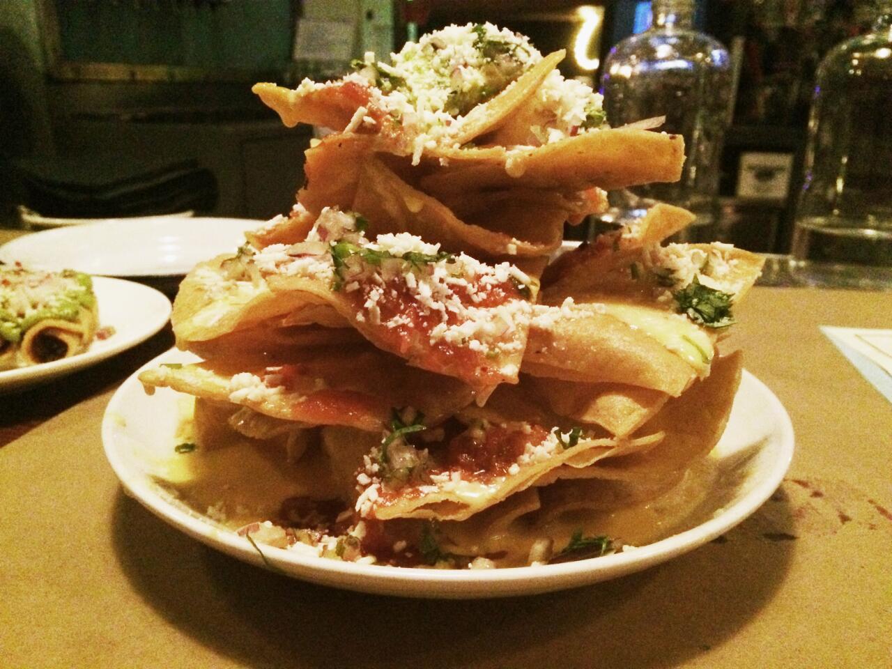 The $5 queso nachos from Bar Ama are available during the restaurant's happy hour, also known as Super Nacho Hour.