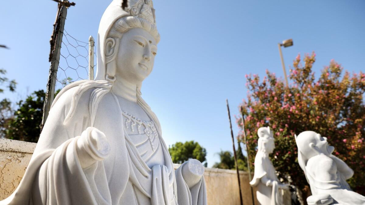 This statue at Huong Tich Temple in Santa Ana was among those vandalized.