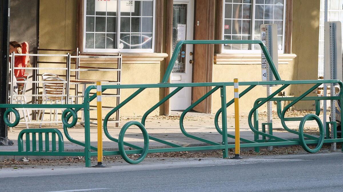 A bike corral shaped like a car in front of Tony's Darts Away. The Burbank City Council decided to continue with its bike corral pilot program.