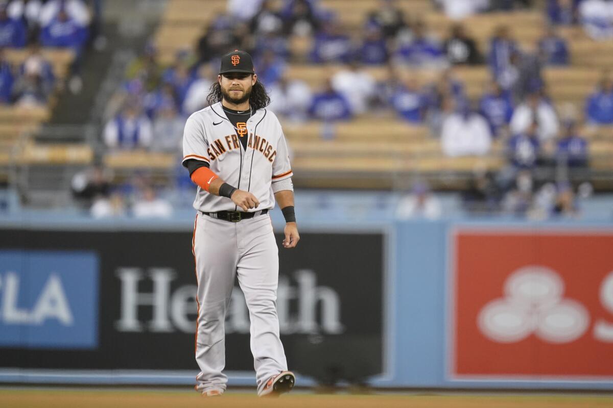 San Francisco Giants shortstop Brandon Crawford warms up before Game 3 of the NLDS against the Dodgers on Monday.