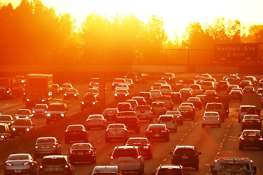 LOS ANGELES, CA MARCH 27, 2015 - Sunrise for drivers as morning traffic begins to swell on the East and West bound 101 Freeway in the San Fernando Valley near White Oak on the second day of a heat wave brought on by a high pressure system over the area on March 27, 2015. (Al Seib / Los Angeles Times)