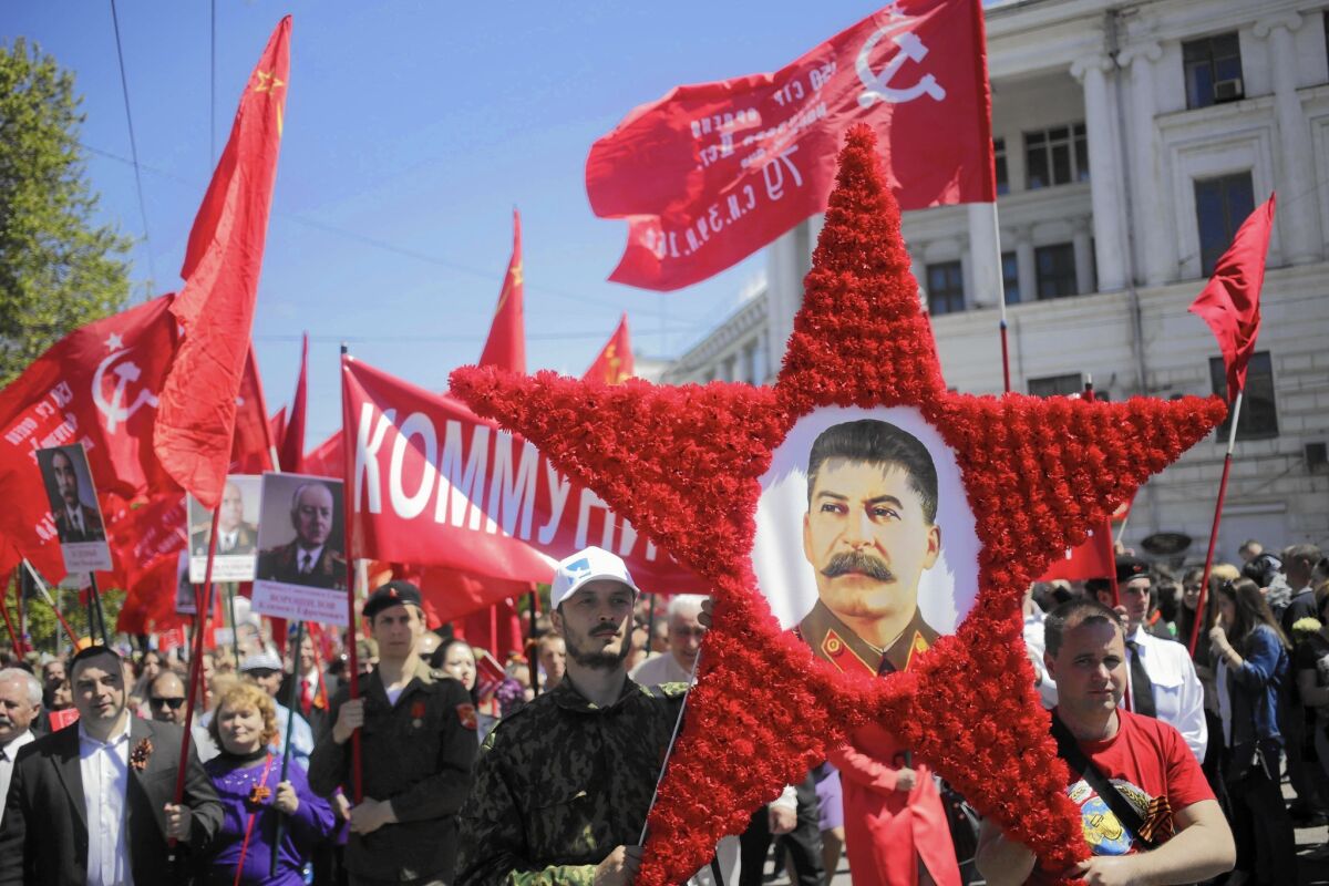 Marchers carry a portrait of Josef Stalin in Sevastopol, Crimea, on May 9 as they mark the 70th anniversary of the end of World War II.