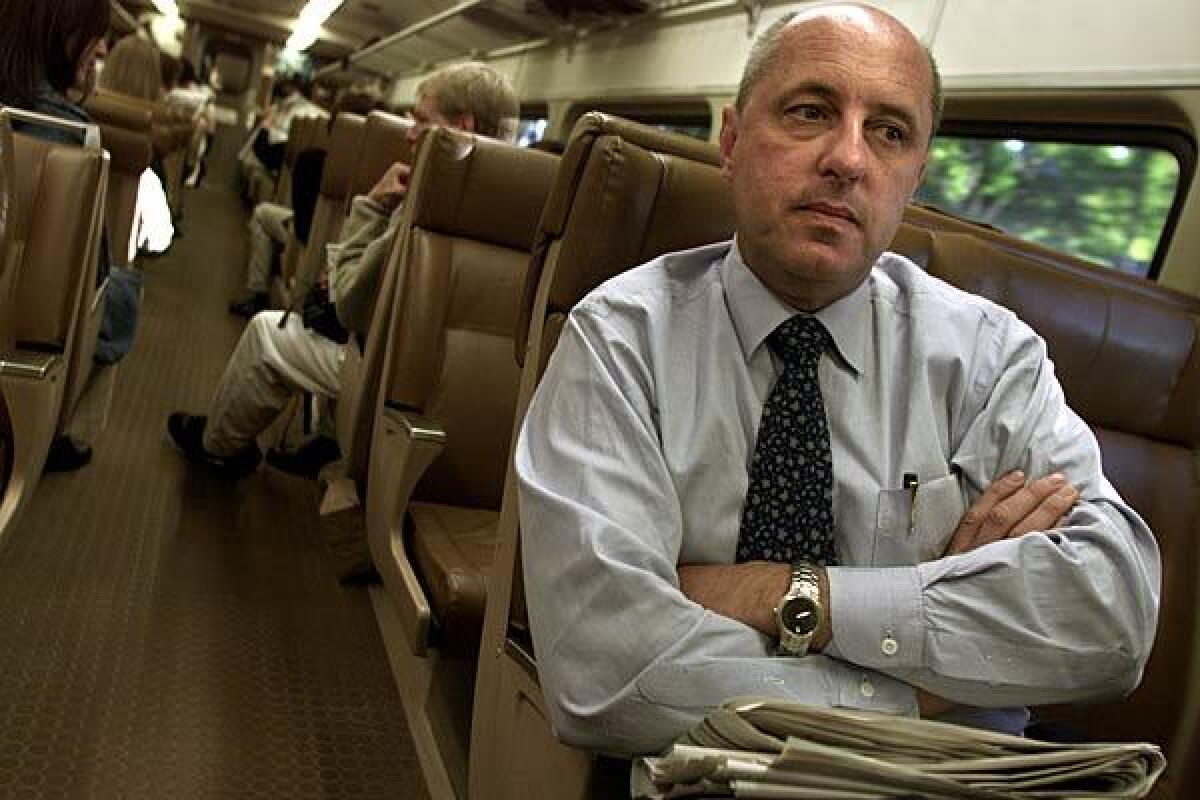 Walter Pilipiak rides the commuter train, heading for borrowed office space. "We are New Yorkers, and we will survive," he told his parent firm last week. "We are just lucky, lucky to be here."