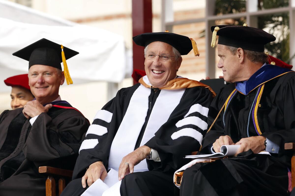 Former USC football coach Pete Carroll is beaming after receiving his honorary degree during USC commencement ceremonies on Friday.
