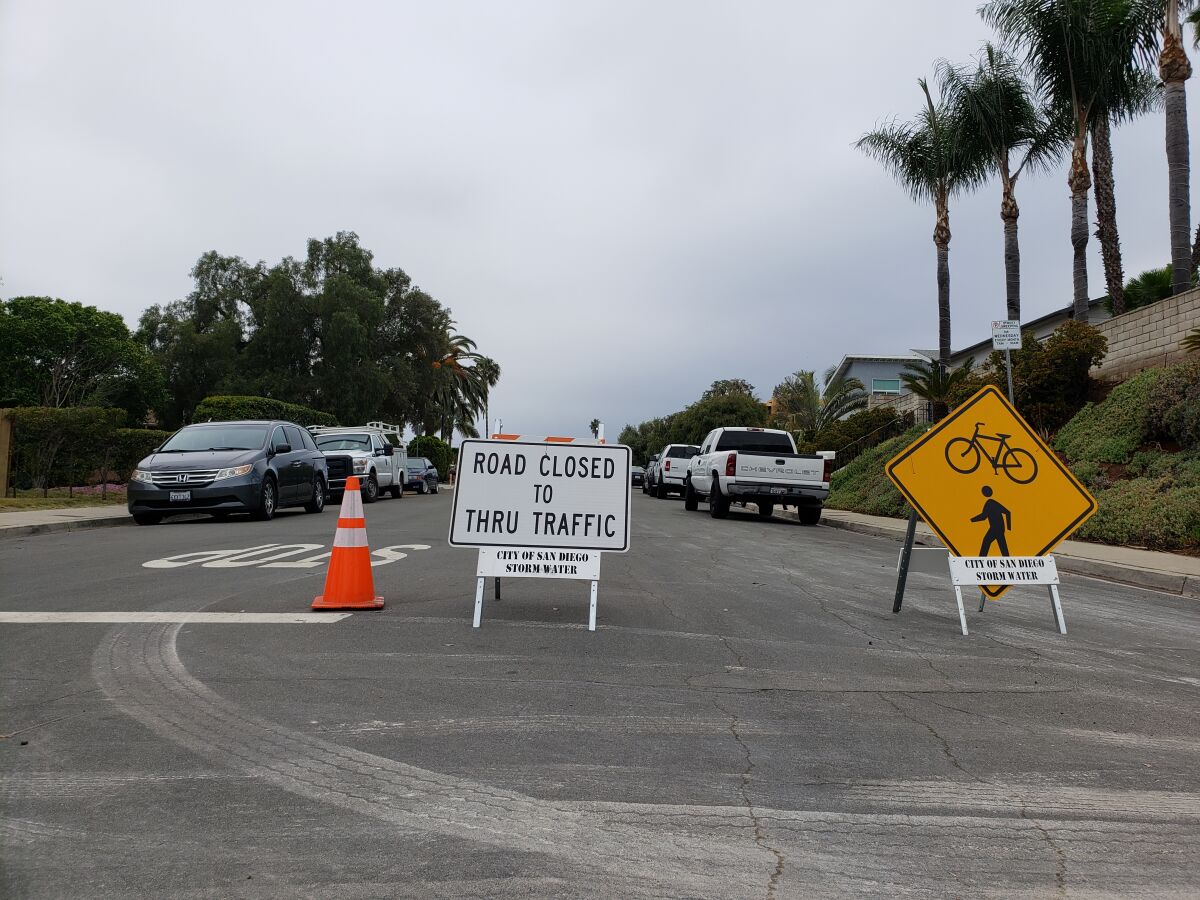 Signs mark the entrance to a "slow street" in Pacific Beach.