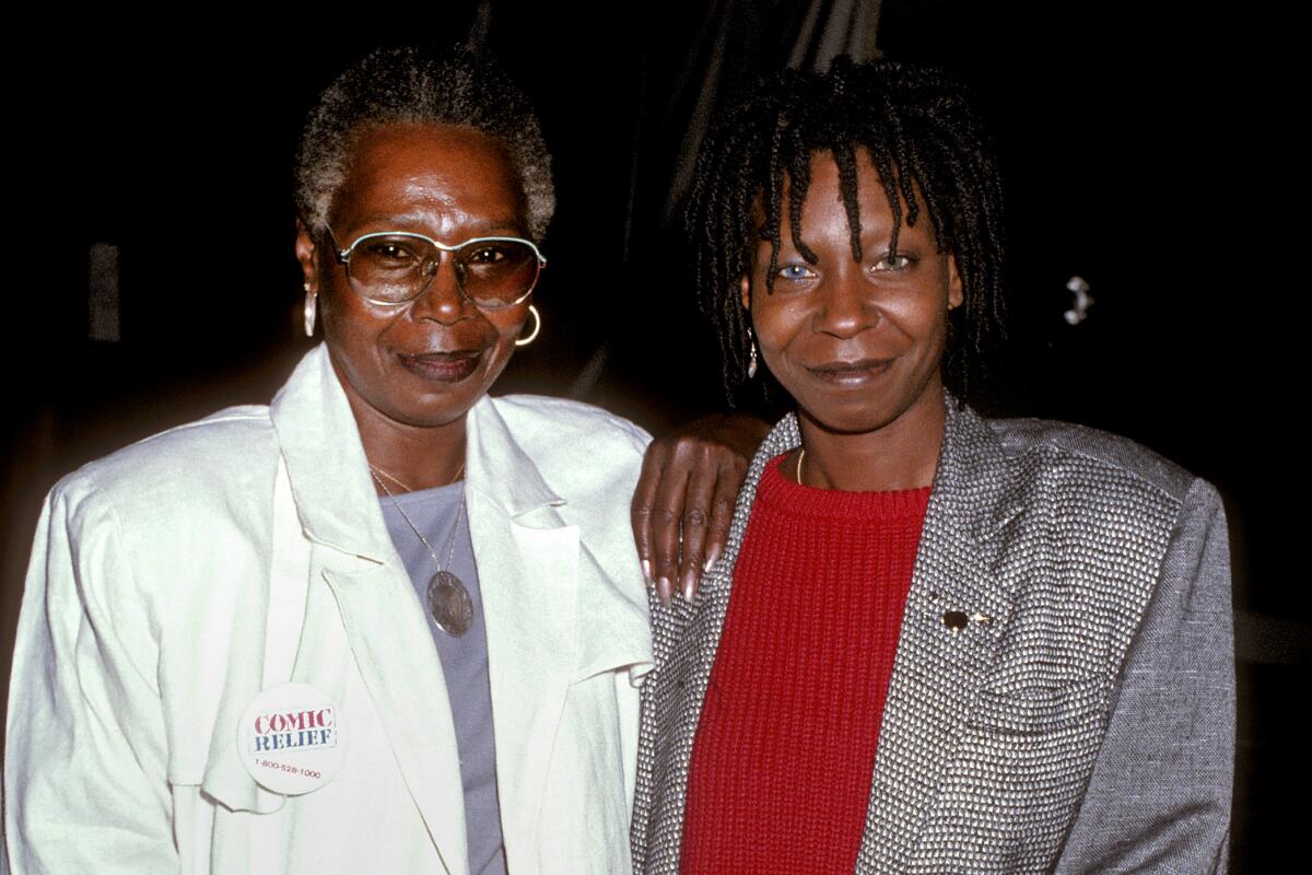 A photo from the '80s of Whoopi Goldberg and her mother, Emma Johnson, both in blazers.