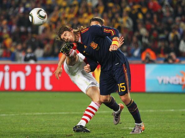 Jonathan Santana of Paraguay kicks Sergio Ramos in the head during the 2010 FIFA World Cup South Africa Quarter Final match between Paraguay and Spain at Ellis Park Stadium on July 3, 2010 in Johannesburg, South Africa.