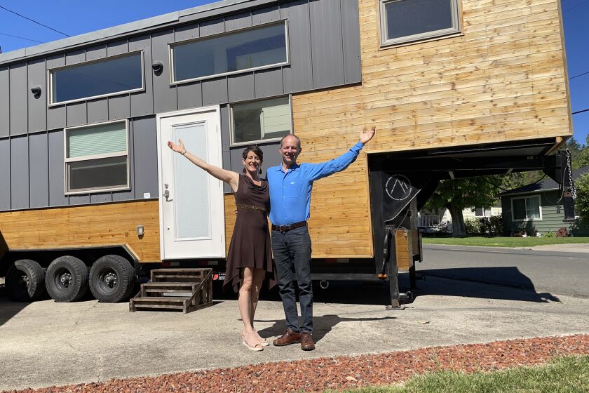 Lindsay and Eric Wood, founders of Experience Tiny Homes of San Diego, in front of their home. They will speak at TinyFest.