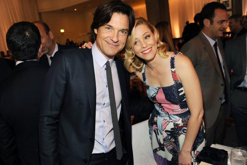 Host Jason Bateman, left, poses with Grace Kelly Award honoree Elizabeth Banks during the 2014 March of Dimes Celebration of Babies at the Beverly Wilshire Hotel on Friday.
