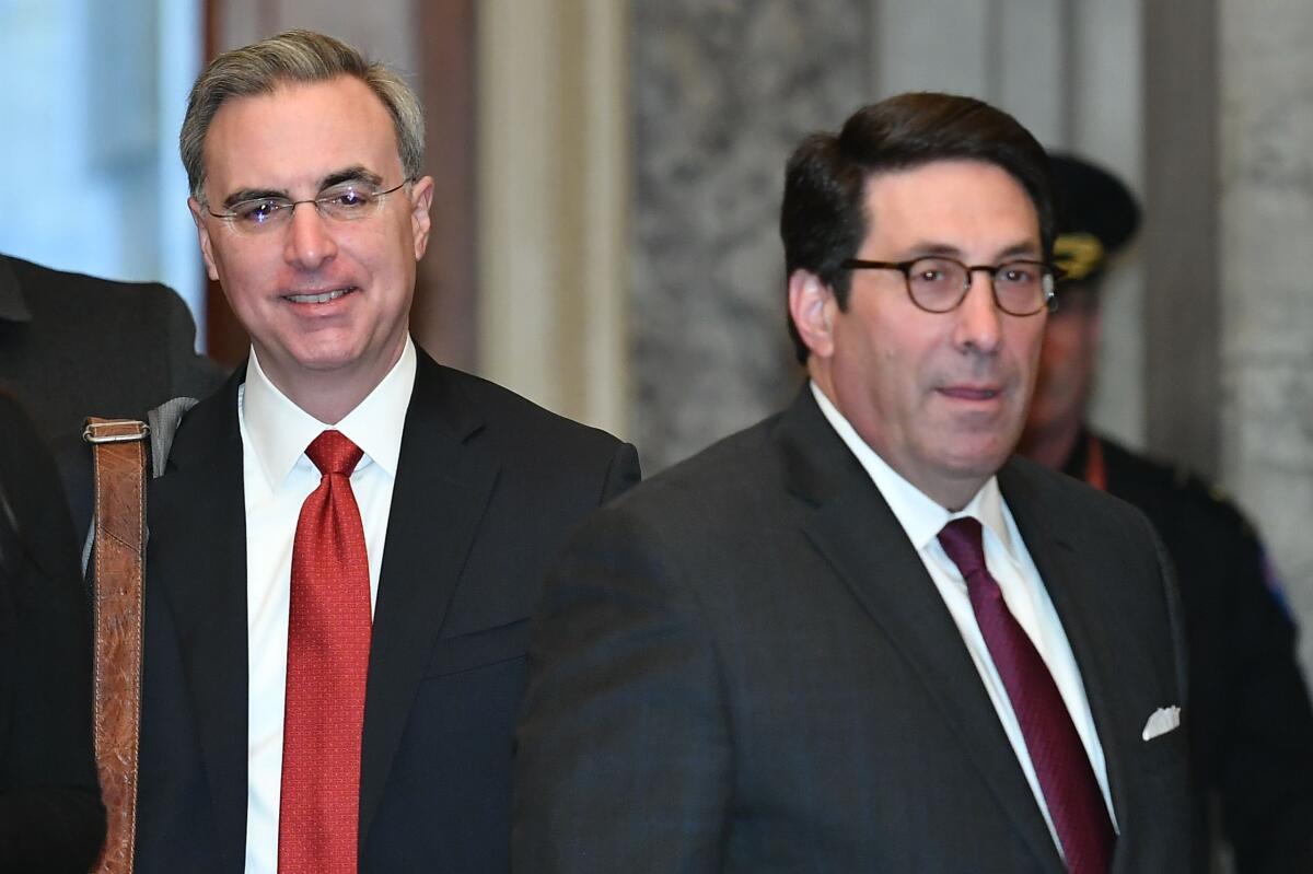 Defense team lawyer Pat Cipollone, left, and President Trump's personal lawyer Jay Sekulow arrive for the impeachment trial of President Trump on Capitol Hill on Thursday.
