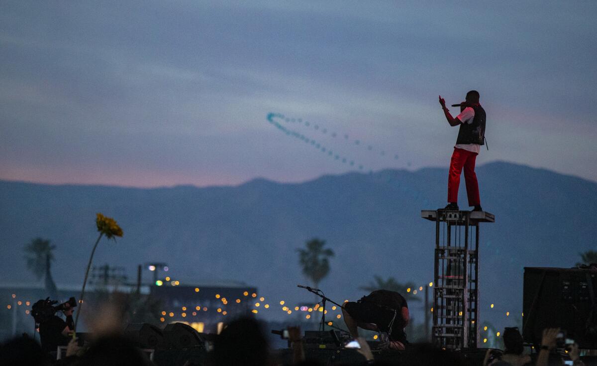 YG towers above the Sahara stage at the Coachella Valley Music and Arts Festival. (Brian van der Brug / Los Angeles Times)