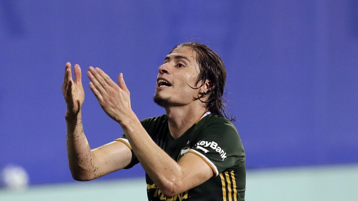 Portland Timbers defender Jorge Villafana disputes a ruling by officials on Aug. 5, 2020, in Kissimmee, Fla.