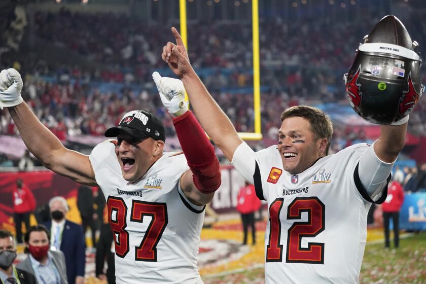 Tampa Bay Buccaneers tight end Rob Gronkowski, left, and quarterback Tom Brady celebrate after defeating the Kansas City Chiefs in the NFL Super Bowl 55 football game Sunday, Feb. 7, 2021, in Tampa, Fla. The Buccaneers defeated the Chiefs 31-9 to win the Super Bowl. (AP Photo/Ashley Landis)